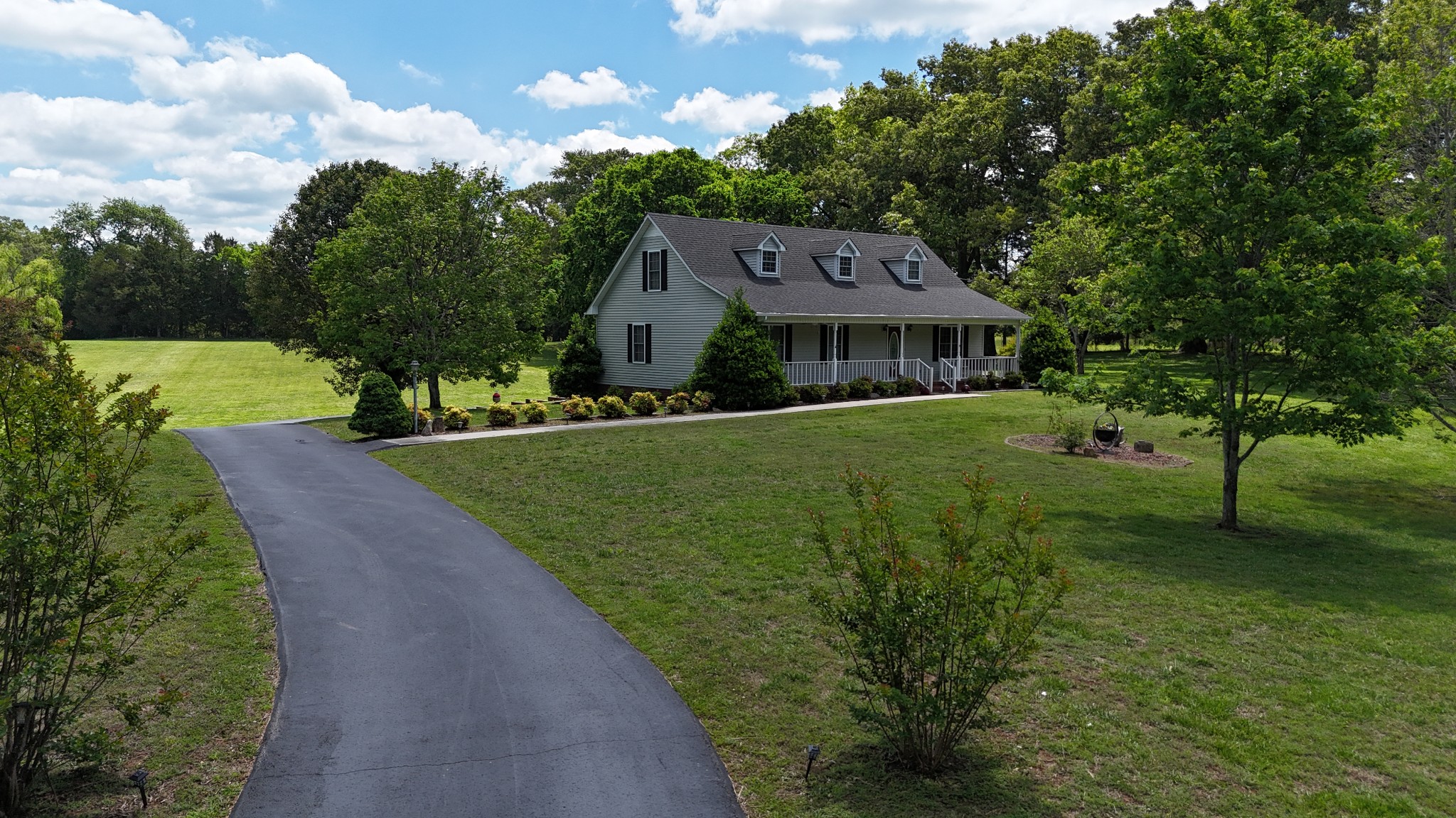5234 Shellsford Road McMinnville, TN 37110 - Photo 55 of 59 a view of a big house with a big yard plants and large trees