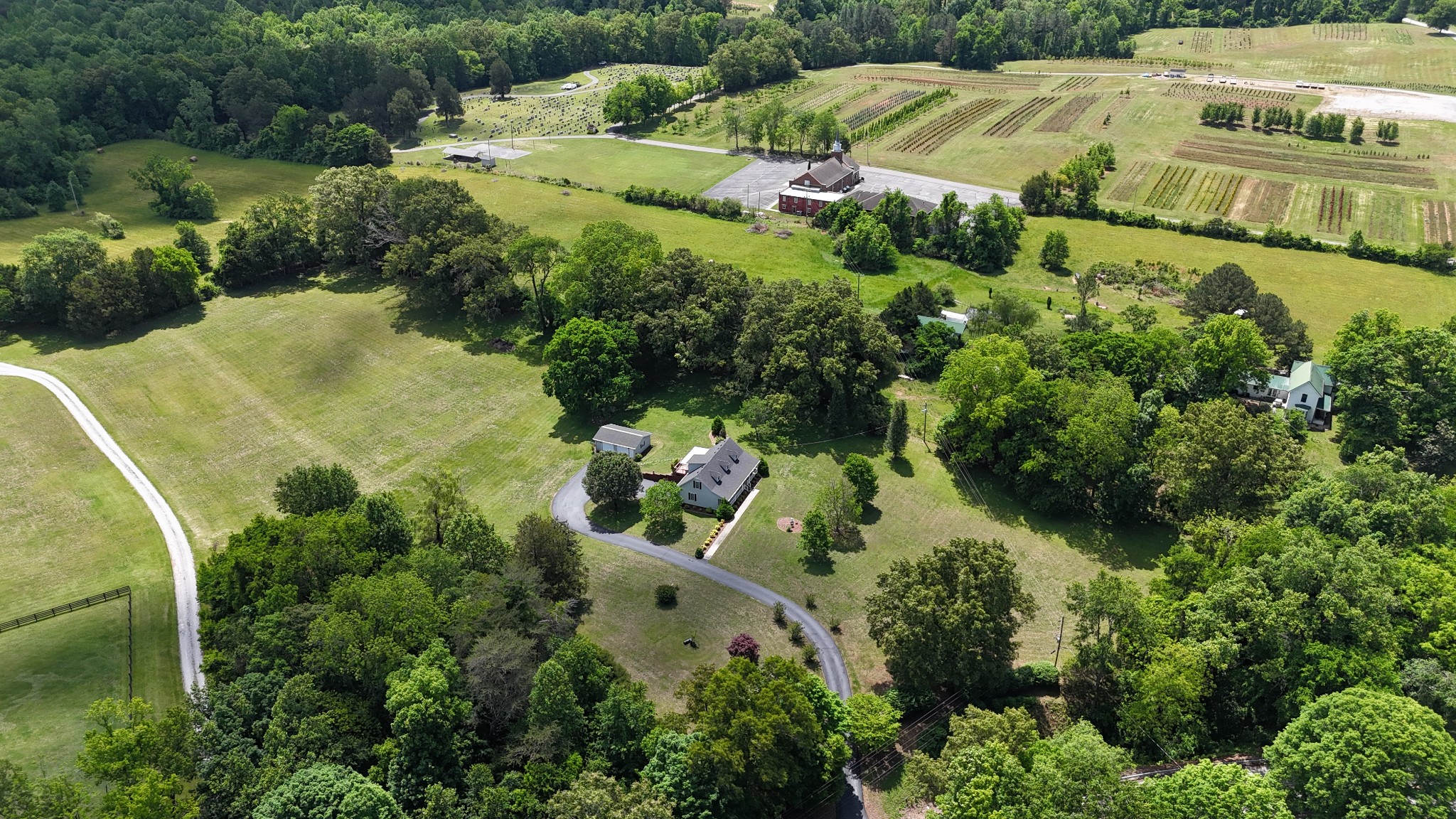 5234 Shellsford Road McMinnville, TN 37110 - Photo 58 of 59 an aerial view of a house with a yard and lake view