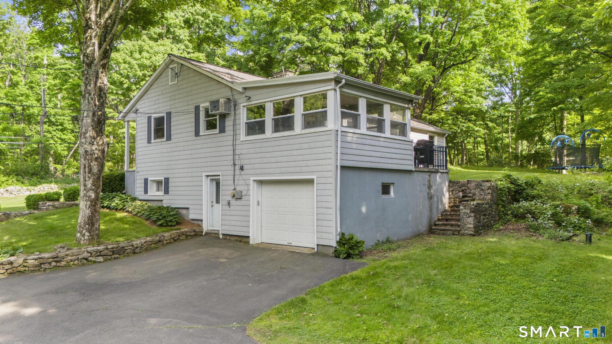 200 Old Huckleberry Road Wilton, CT 06897 - Photo 21 of 24 a house view with a garden space