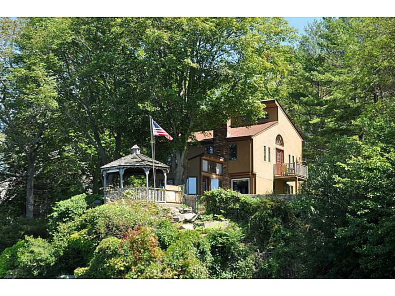 Exterior Back. This home offers great views and privacy.  Over 100  of waterfront grace the point.