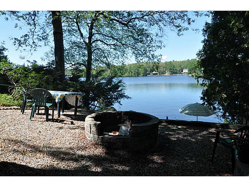 155 Reservoir Road Burrillville, RI 02859 - Photo 16 of 24 Waterfront/Dock/Pier. Picnic and fire pit area just above sandy beach area.