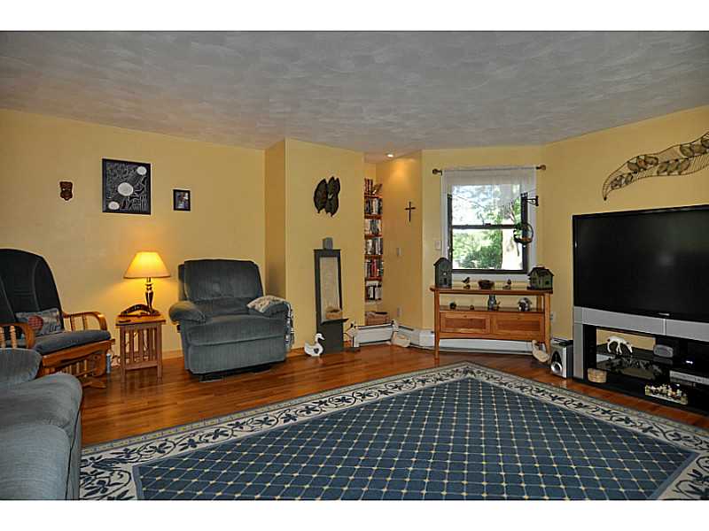 155 Reservoir Road Burrillville, RI 02859 - Photo 4 of 24 Living Room. Open living area, hardwood flooring and garden views. This is a great home for entertaining!