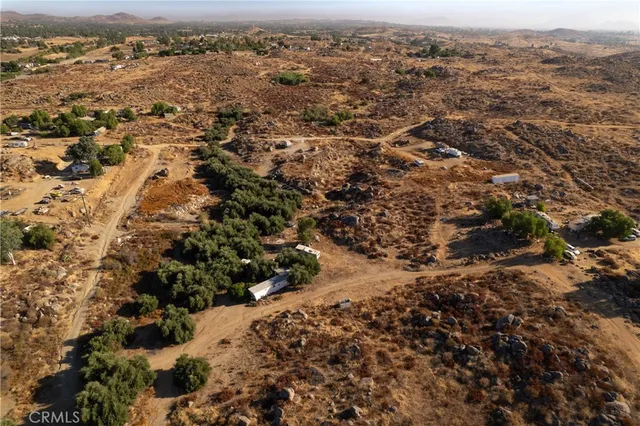 an aerial view of house with yard