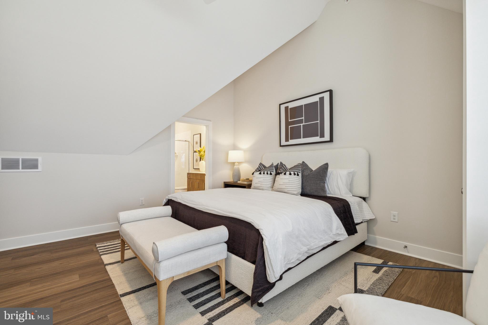 17 Mainland Road, Unit 217 Harleysville, PA 19438 - Photo 18 of 23 a bedroom with a bed and wooden floor