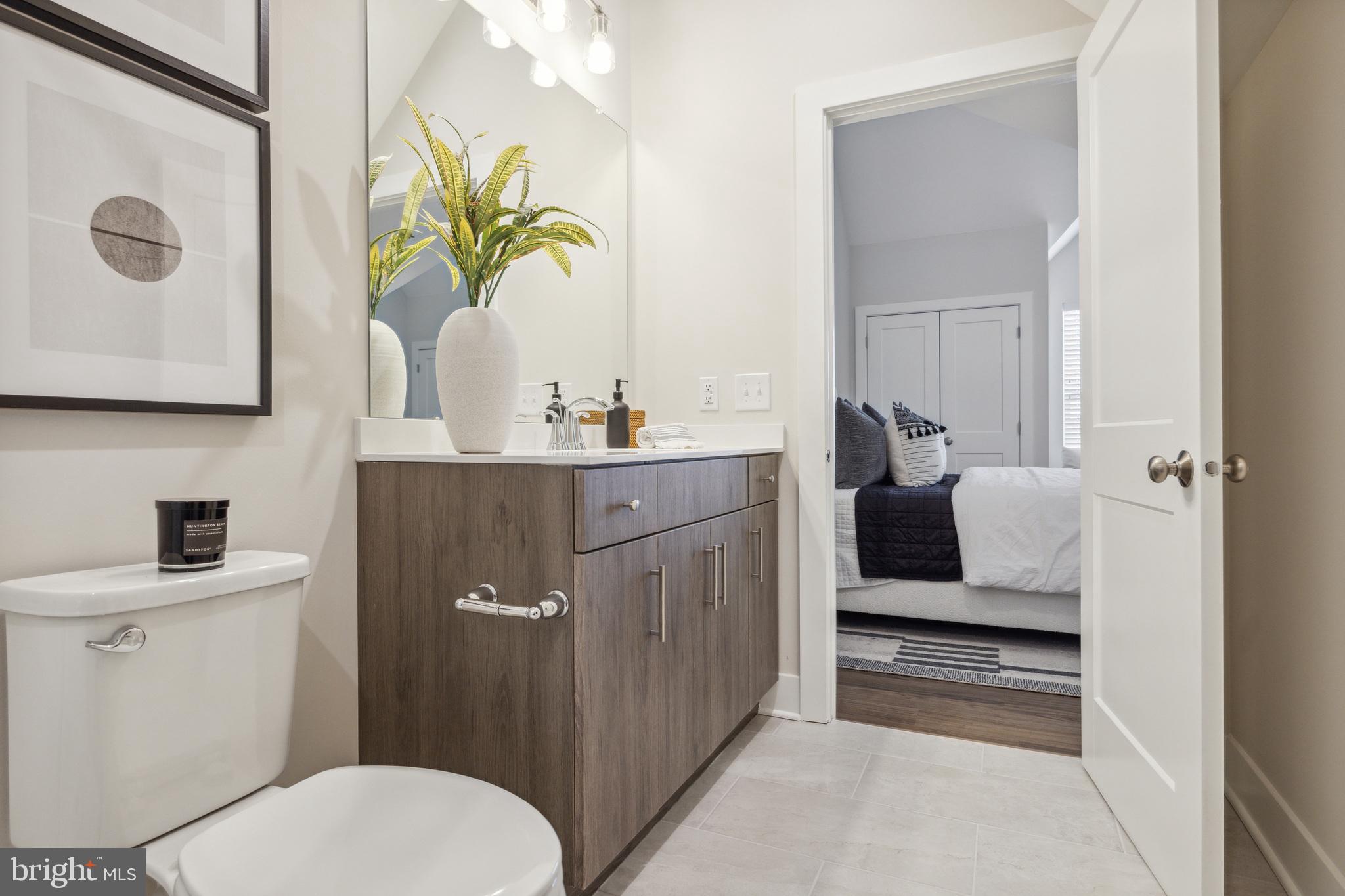 17 Mainland Road, Unit 217 Harleysville, PA 19438 - Photo 20 of 23 a bathroom with a sink a toilet and mirror