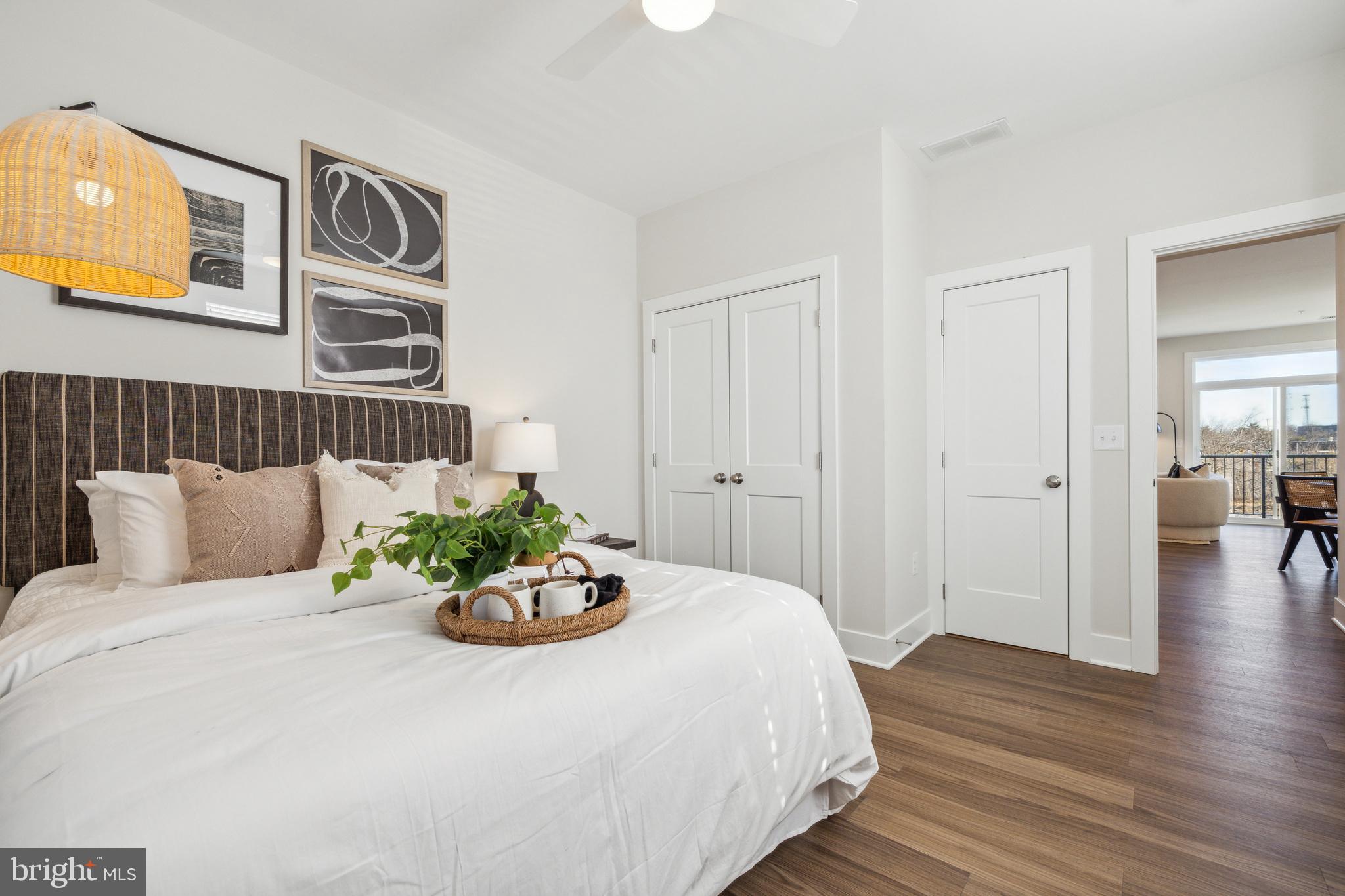 17 Mainland Road, Unit 217 Harleysville, PA 19438 - Photo 9 of 23 a bedroom with a bed and wooden floor