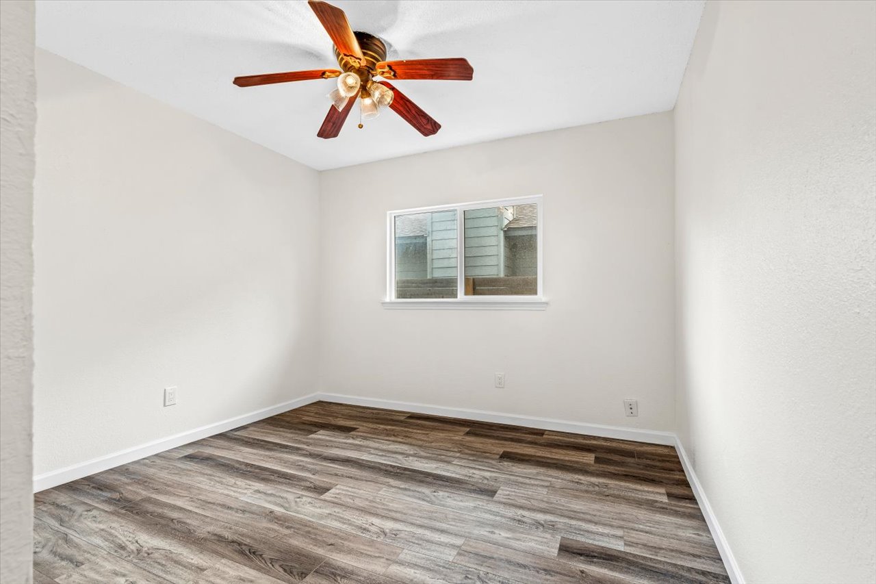 4004 Danli Lane Austin, TX 78749 - Photo 12 of 40 a view of empty room with wooden floor
