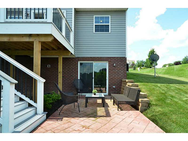 113 Walnut Drive McKees Rocks, PA 15136 - Photo 17 of 21 Patio/Deck. Below the deck sits a stamped concrete patio.