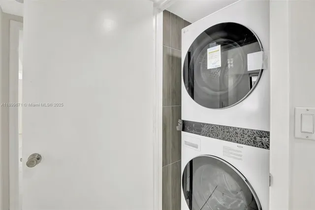 a close view of utility room with washer and dryer