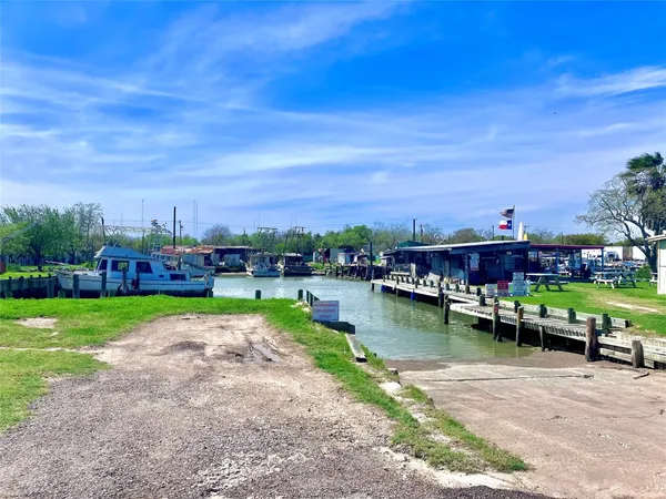 a view of a lake with a houses in the background