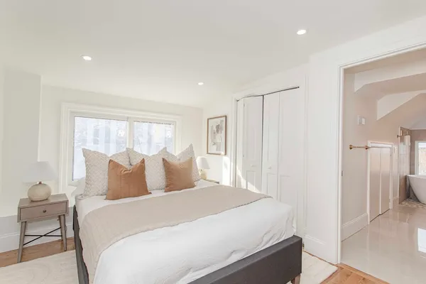 a bedroom with a bed and a view of bathroom