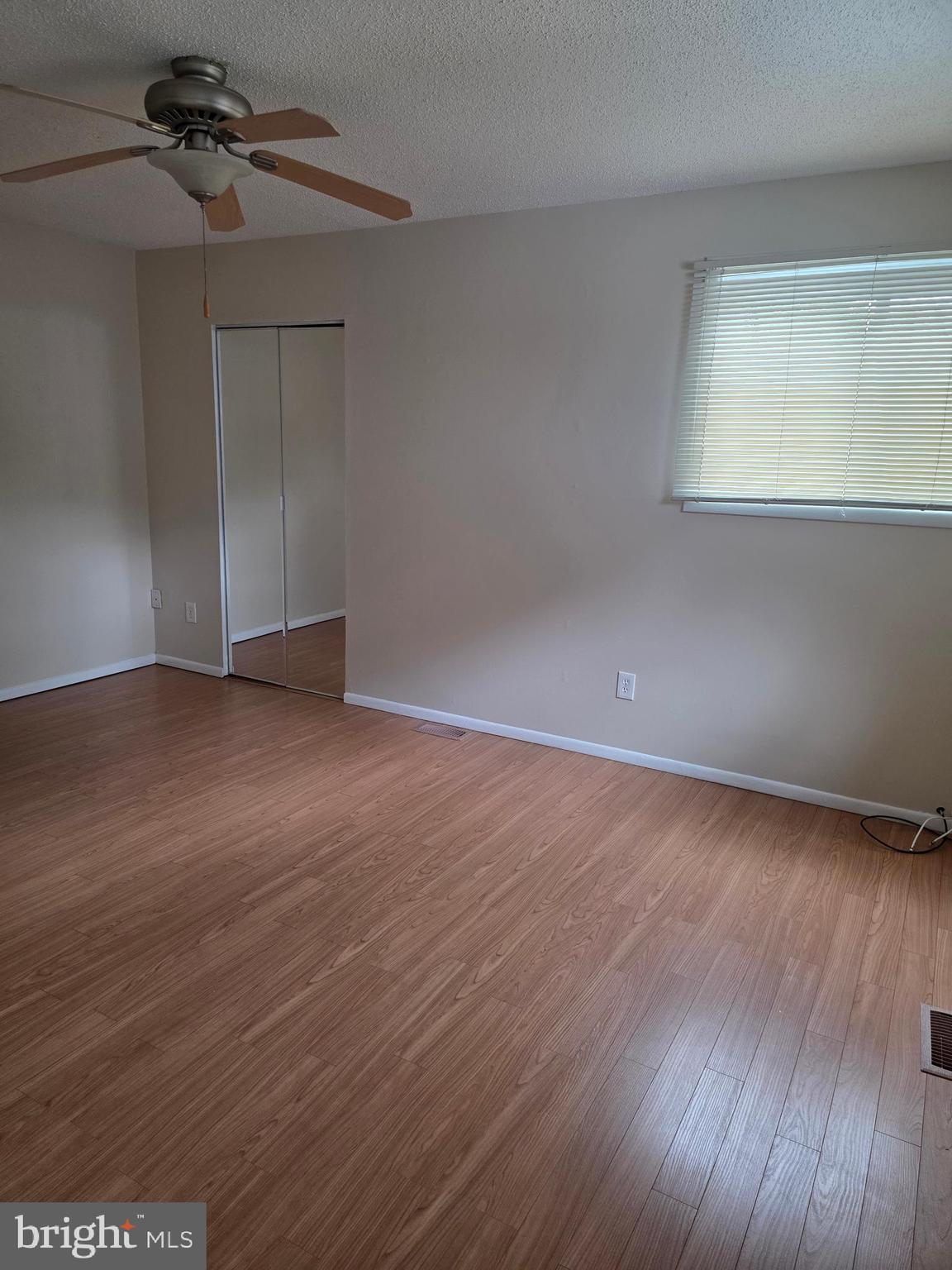 9 Georgetown Road Lindenwold, NJ 08021 - Photo 8 of 14 a view of an empty room with wooden floor and a window