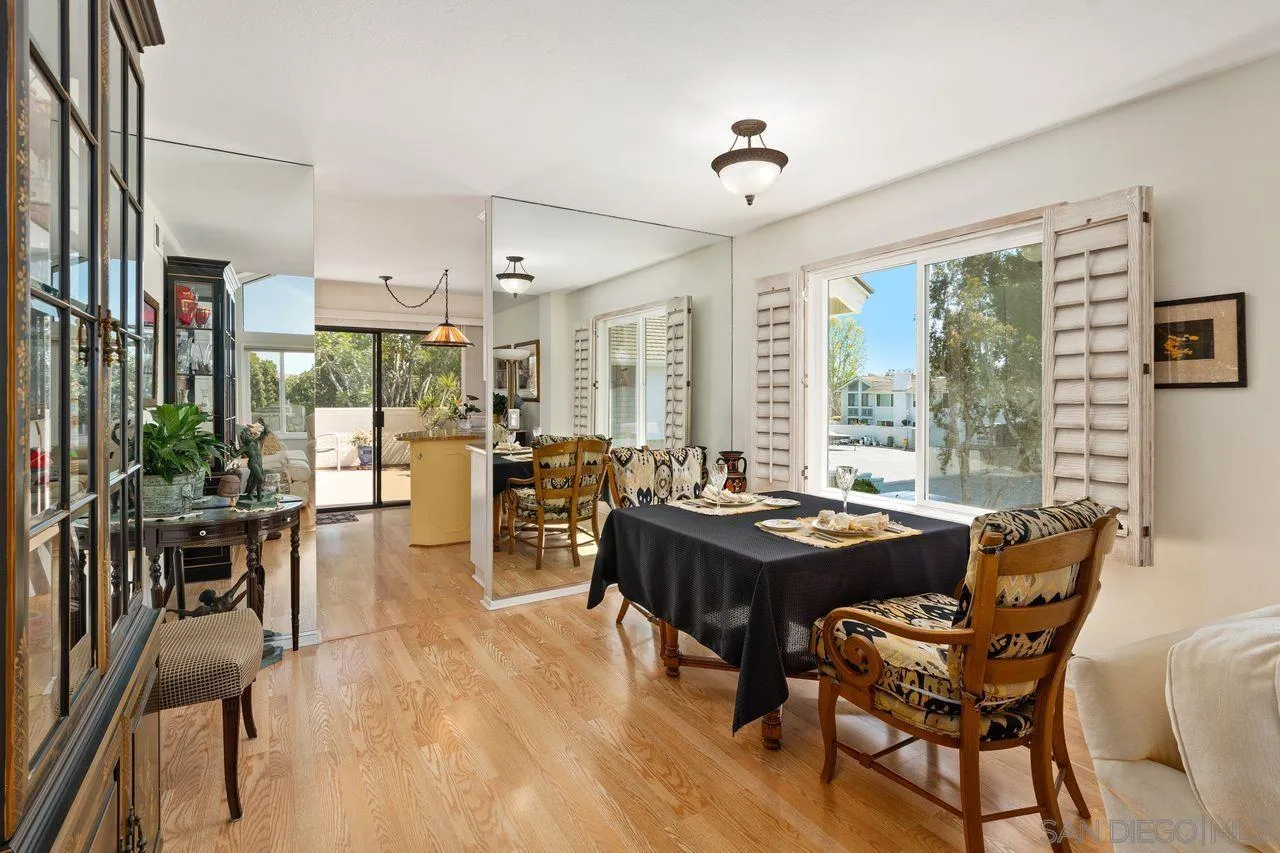 839 Mistletoe Lane Carlsbad, CA 92011 - Photo 17 of 50 a dining room with furniture window and wooden floor