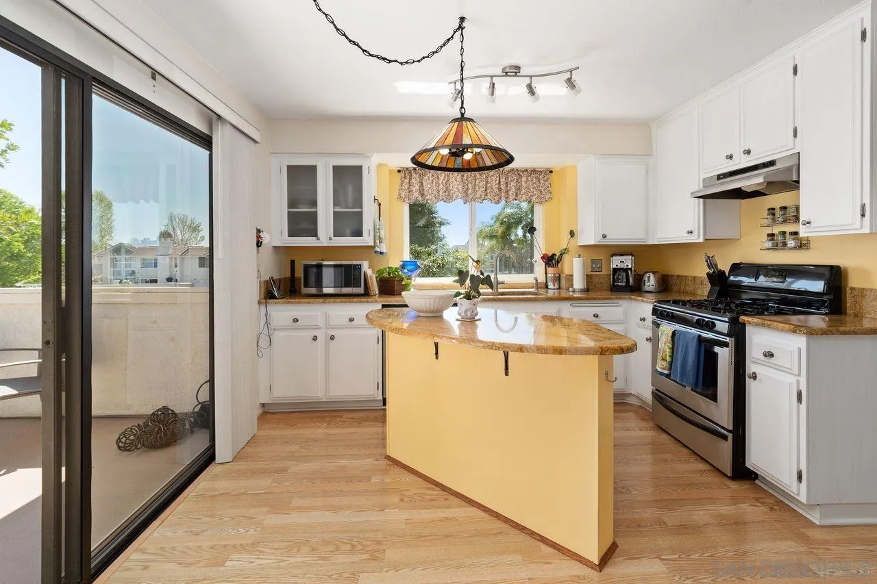 839 Mistletoe Lane Carlsbad, CA 92011 - Photo 20 of 50 a kitchen with a sink stove and refrigerator