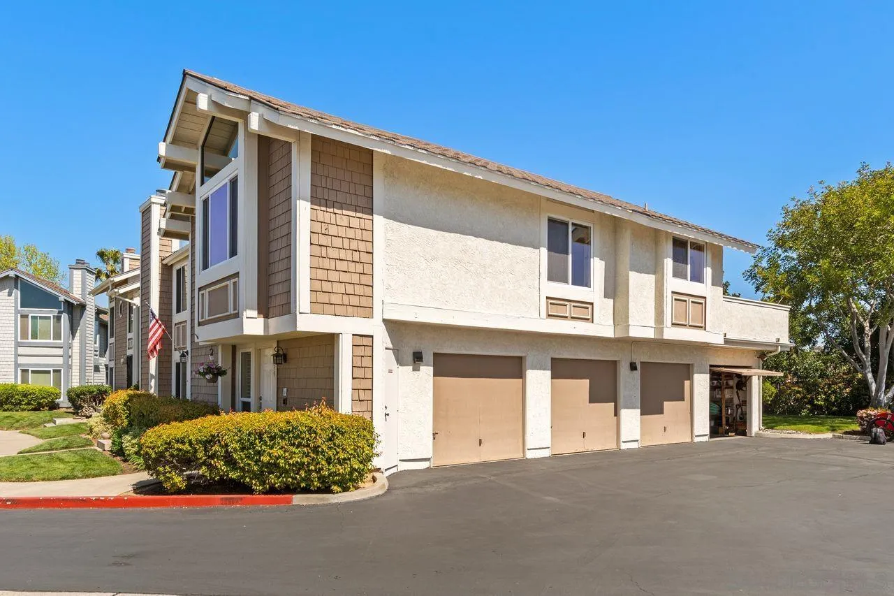 839 Mistletoe Lane Carlsbad, CA 92011 - Photo 2 of 50 a front view of a house with a garden