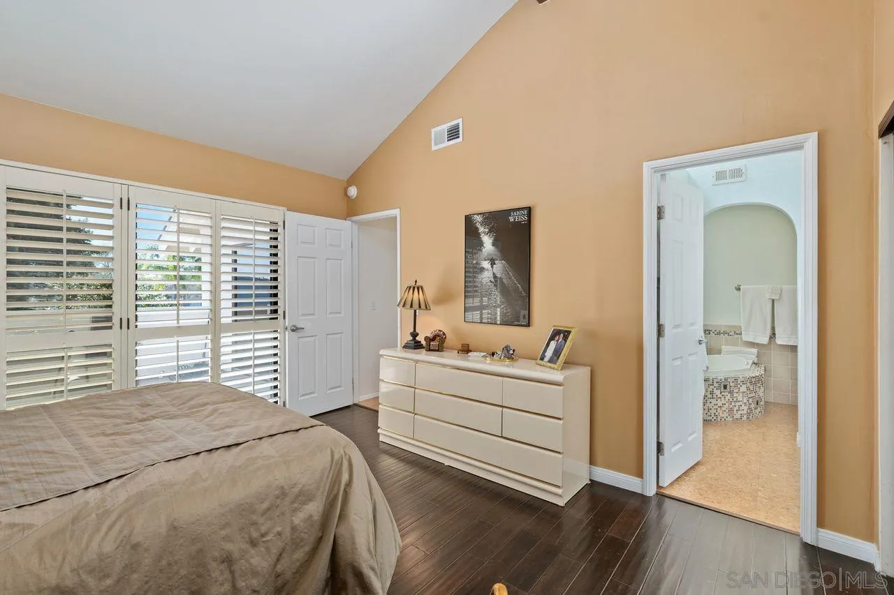 839 Mistletoe Lane Carlsbad, CA 92011 - Photo 25 of 50 a bedroom with a bed and a large window