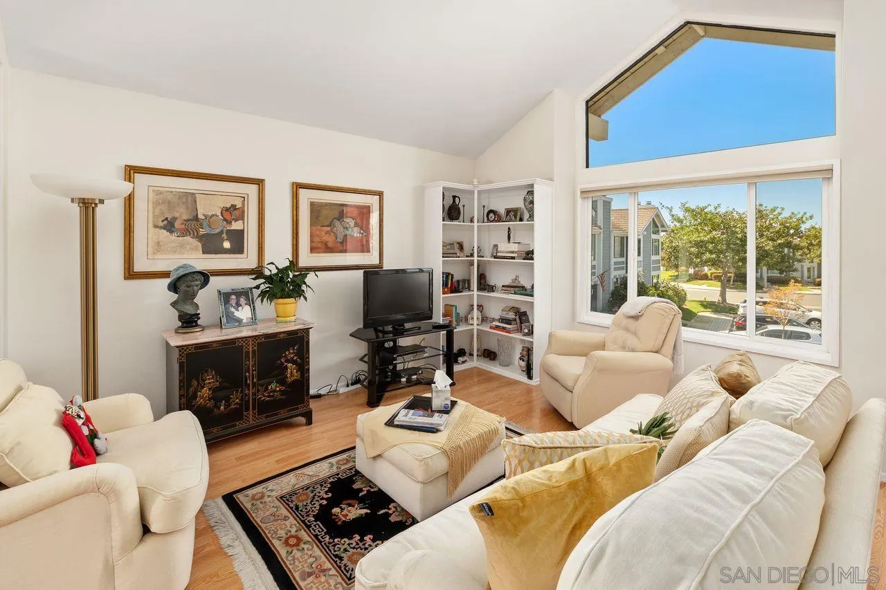 839 Mistletoe Lane Carlsbad, CA 92011 - Photo 29 of 50 a living room with furniture fireplace and a large window