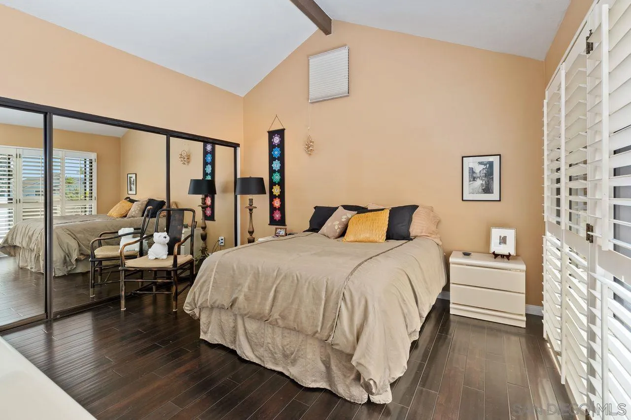 839 Mistletoe Lane Carlsbad, CA 92011 - Photo 5 of 50 a bedroom with a bed and wooden floor