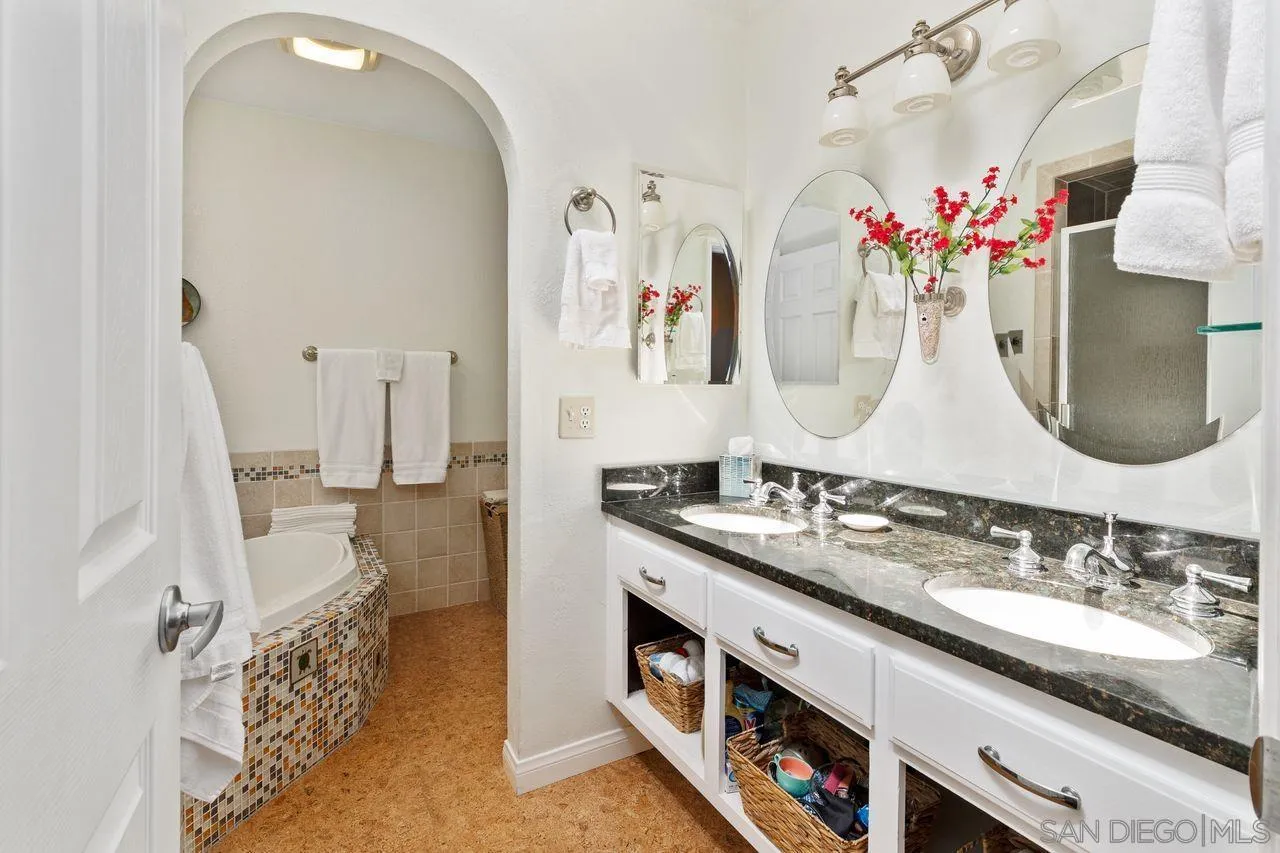 839 Mistletoe Lane Carlsbad, CA 92011 - Photo 8 of 50 a spacious bathroom with double vanity sinks a vanity and a mirror