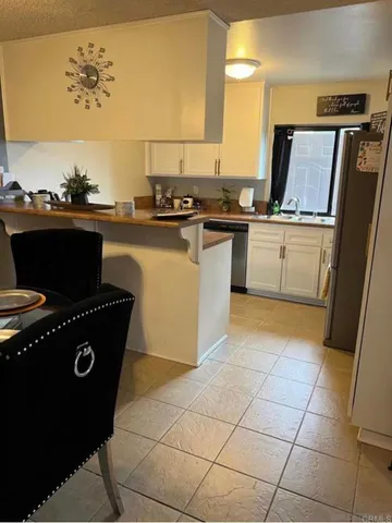 a kitchen with a sink a stove and refrigerator