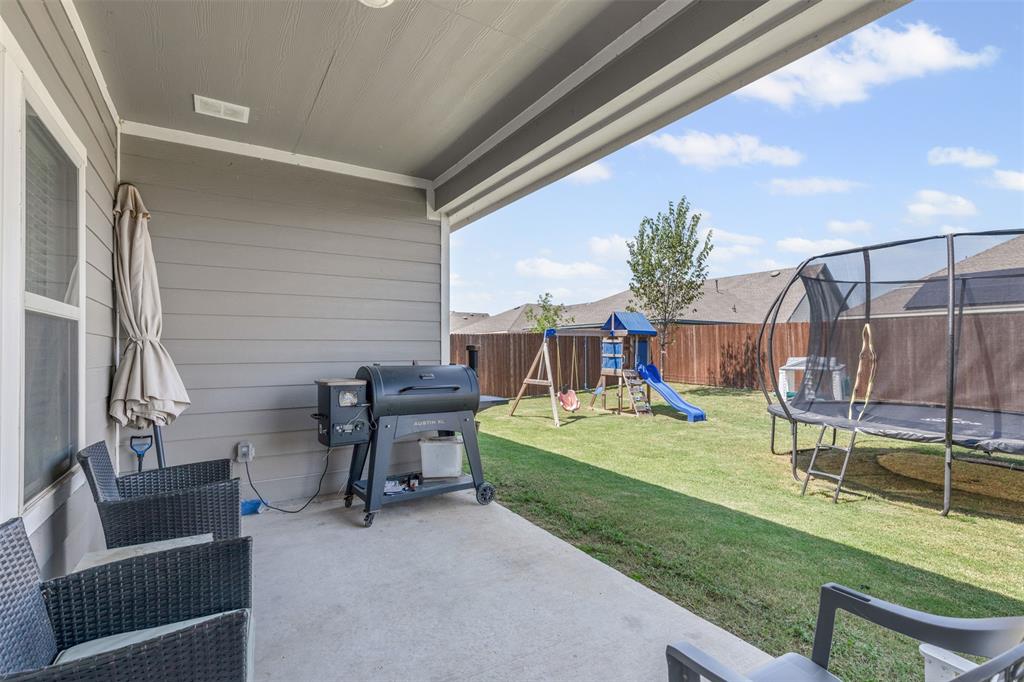 752 Amelia Court Pilot Point, TX 76258 - Photo 15 of 35 a view of a patio with table and chairs and potted plants