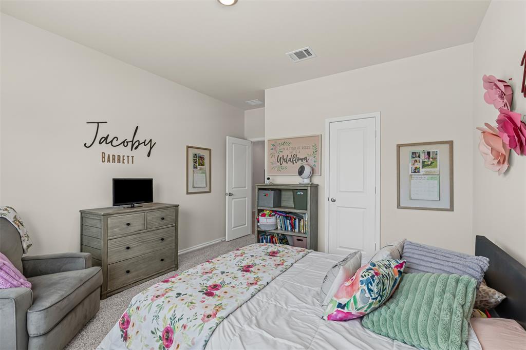 752 Amelia Court Pilot Point, TX 76258 - Photo 18 of 35 a bedroom with a bed and furniture