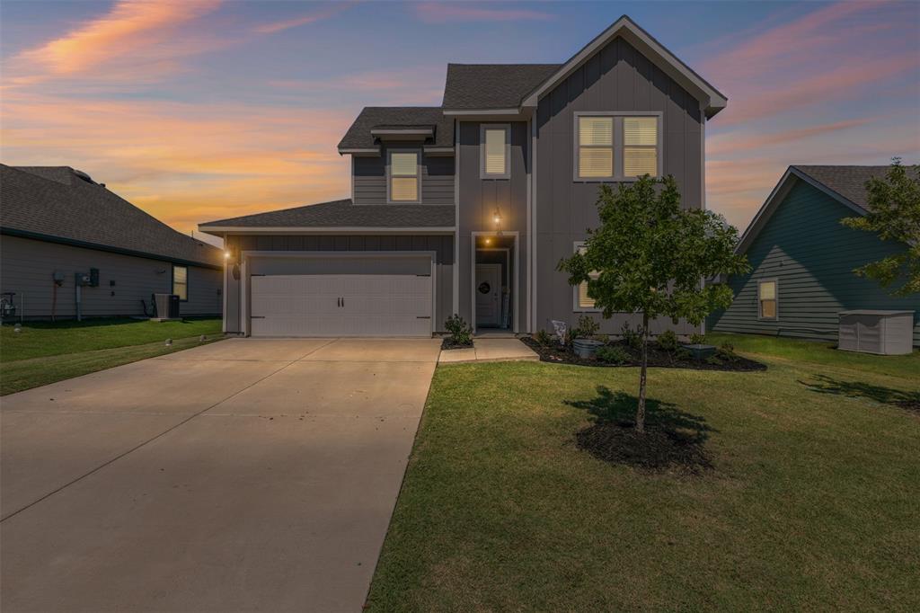 752 Amelia Court Pilot Point, TX 76258 - Photo 2 of 35 a front view of a house with garden