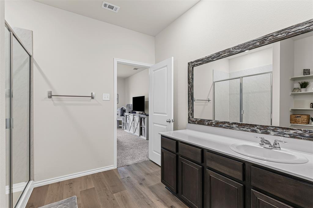 752 Amelia Court Pilot Point, TX 76258 - Photo 21 of 35 a bathroom with a double vanity sink and mirror
