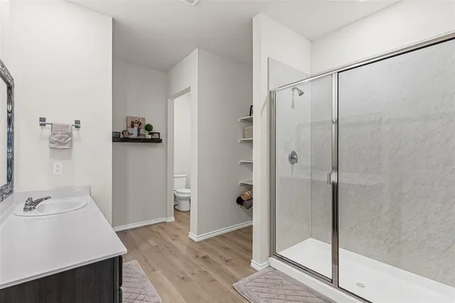 a bathroom with a sink and shower