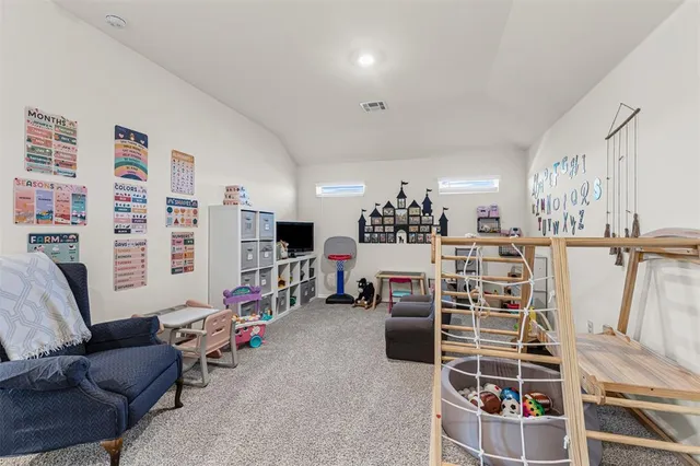 a view of a livingroom with furniture and windows