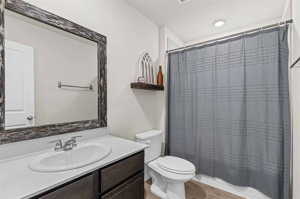 752 Amelia Court Pilot Point, TX 76258 - Photo 27 of 35 a bathroom with a sink and a mirror