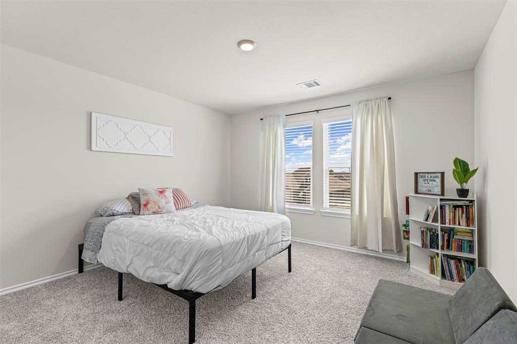 752 Amelia Court Pilot Point, TX 76258 - Photo 29 of 35 a living room with furniture and a book shelf