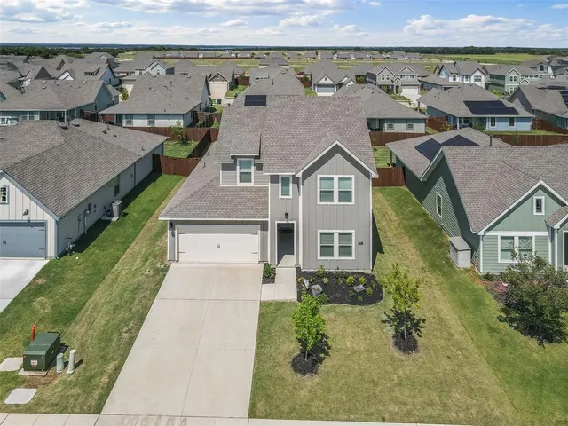 an aerial view of a house with a garden
