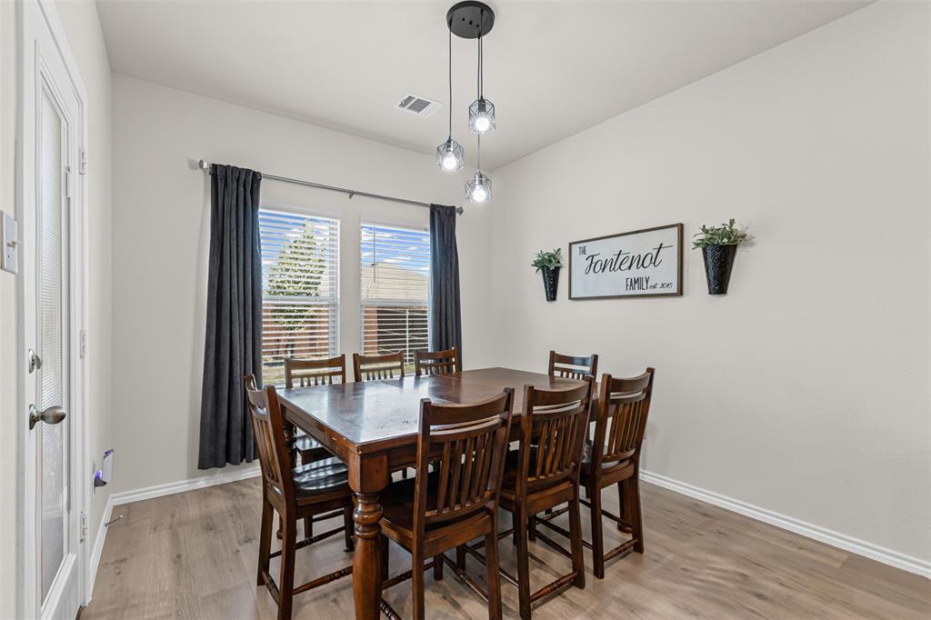 752 Amelia Court Pilot Point, TX 76258 - Photo 9 of 35 a view of a dining room with furniture window and wooden floor