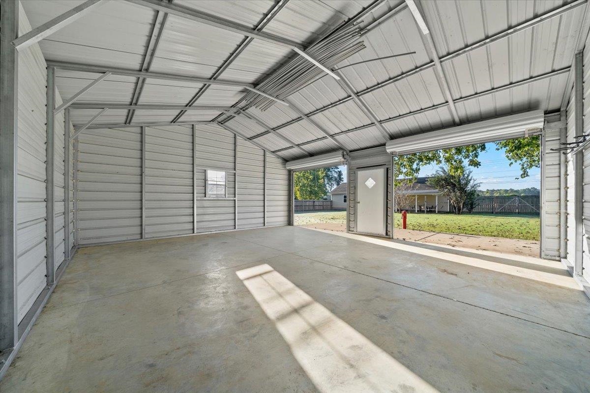 9496 Holly Grove Road Brighton, TN 38011 - Photo 27 of 29 Garage featuring metal wall