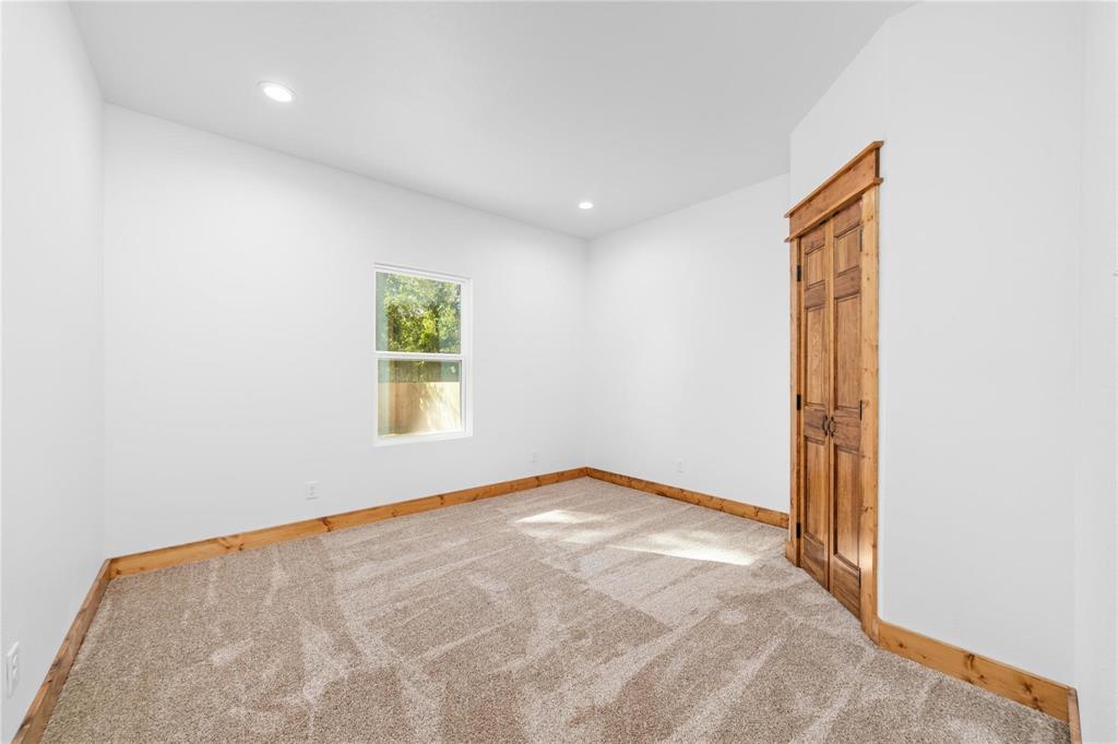 200 Main Street Blanket, TX 76432 - Photo 10 of 11 an empty room with windows and closet