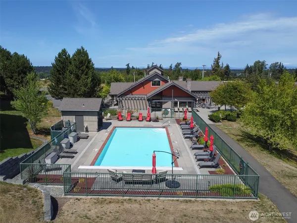 a front view of a building and trees