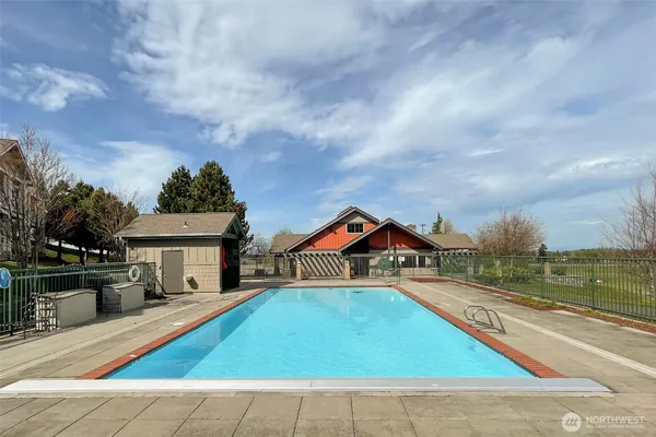 a living room with fireplace furniture and a chandelier
