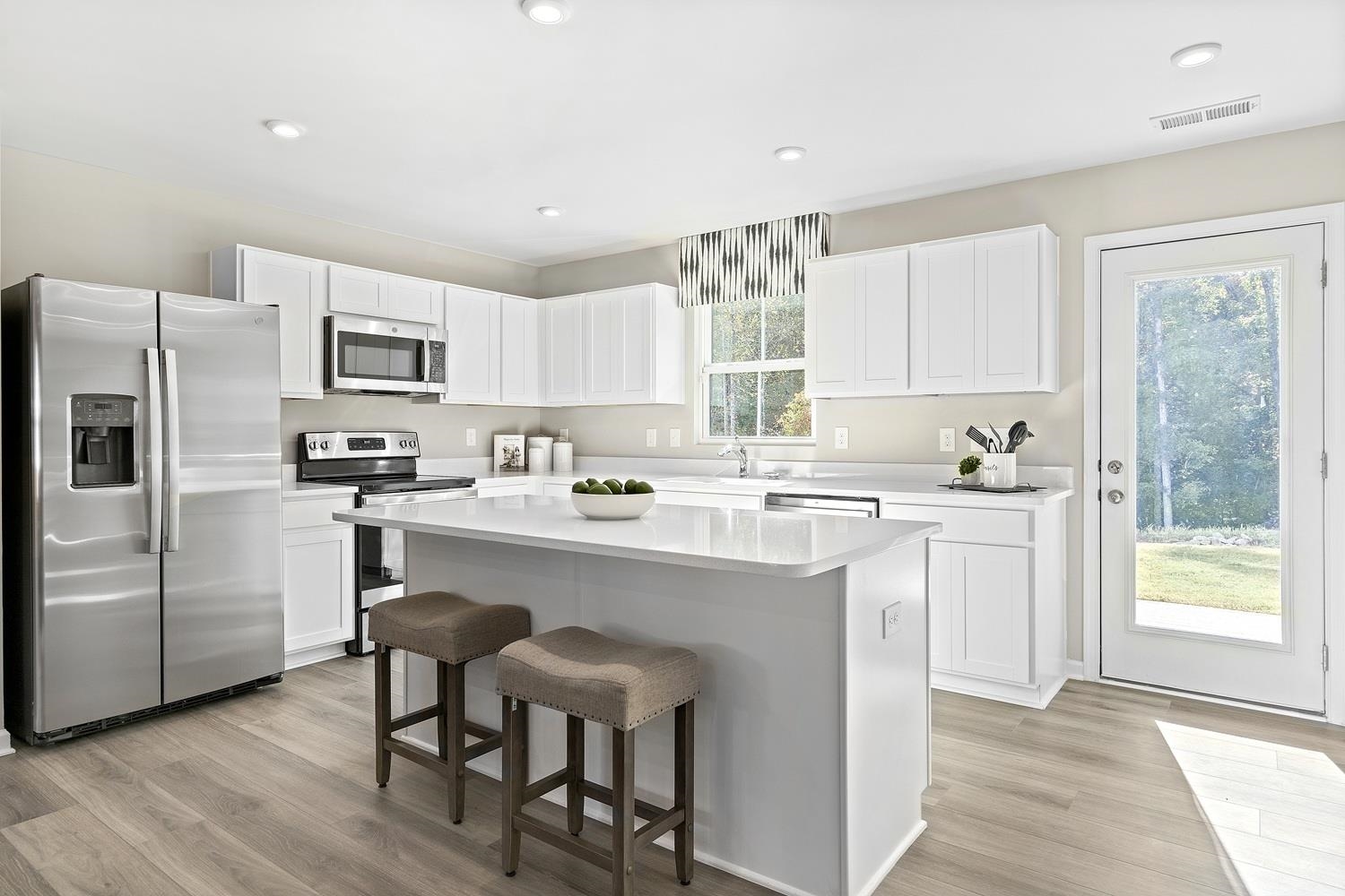 321 Walsh Lane Waynesboro, VA 22980 - Photo 2 of 11 a kitchen with a sink a window and cabinets