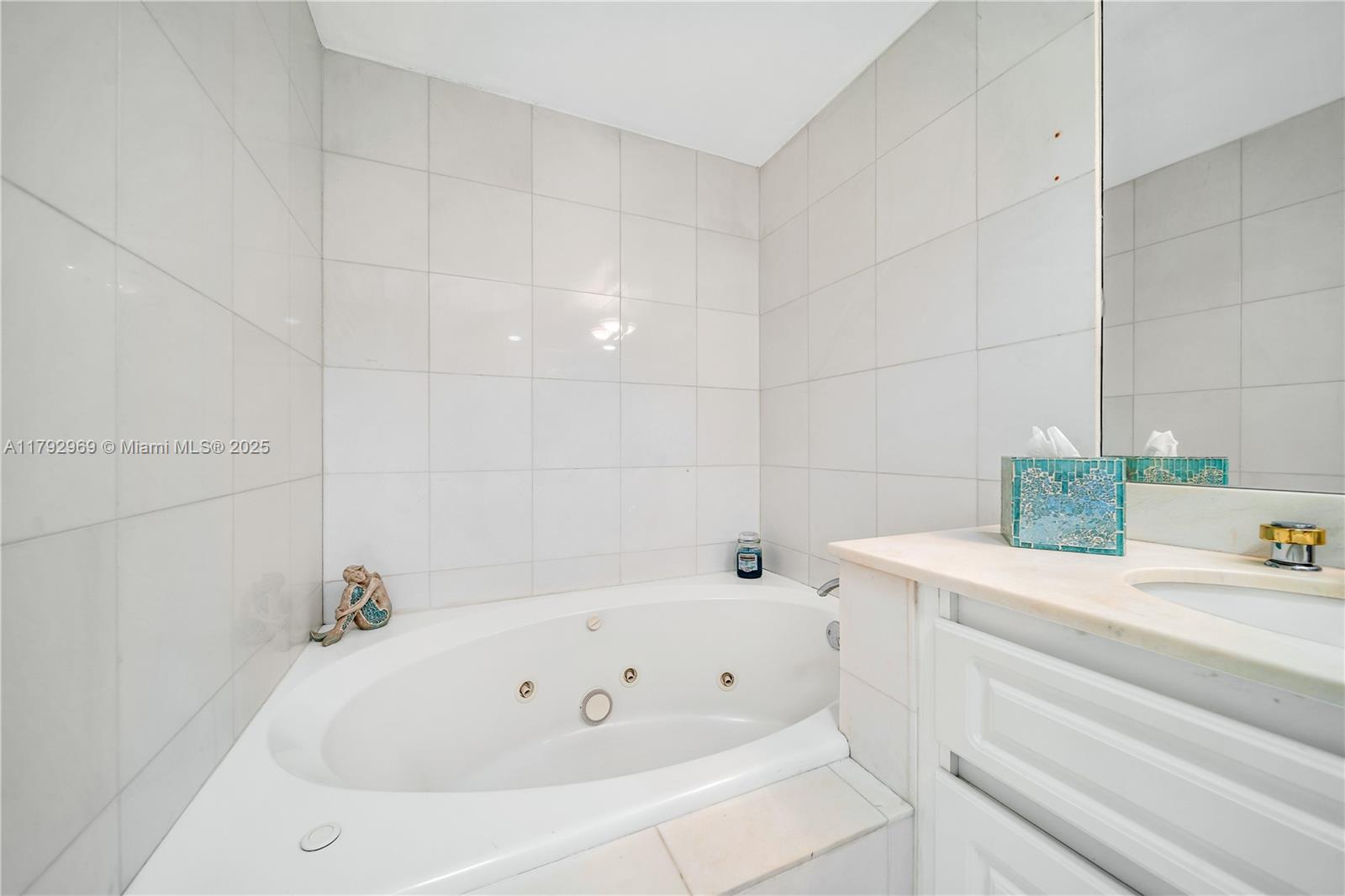 6301 Collins Avenue, Unit 1708 Miami Beach, FL 33141 - Photo 12 of 43 a bathroom with a tub and sink