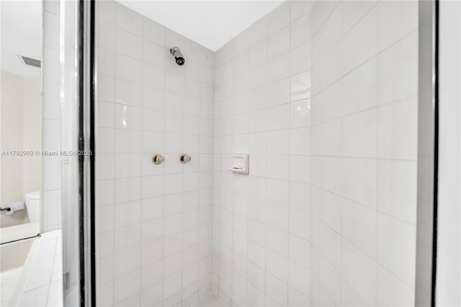 6301 Collins Avenue, Unit 1708 Miami Beach, FL 33141 - Photo 25 of 43 a bathroom with a shower