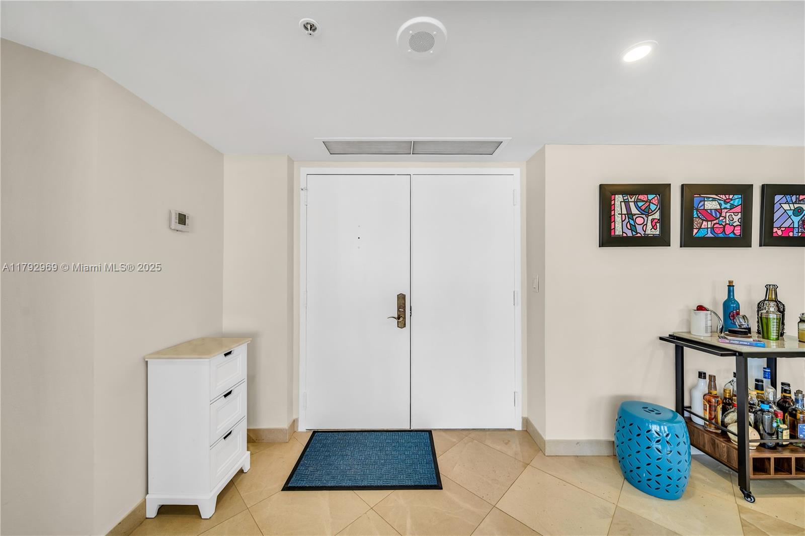 6301 Collins Avenue, Unit 1708 Miami Beach, FL 33141 - Photo 5 of 43 a view of an entryway with wooden floor