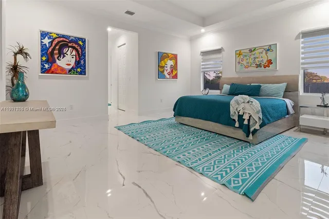 a spacious bathroom with a double vanity sink a mirror and shower