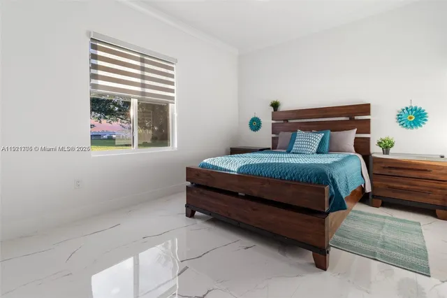 a garden with a bench and some plants