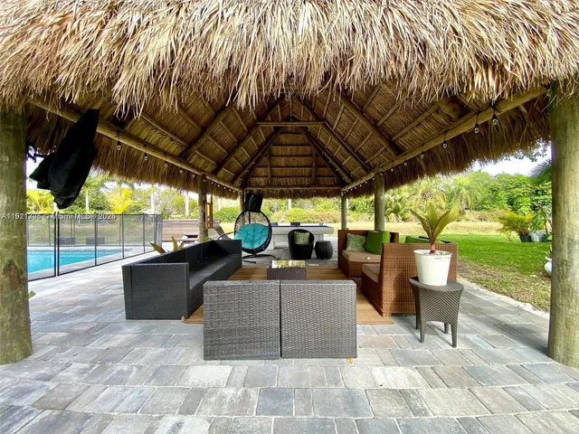 a view of a chairs and tables in patio