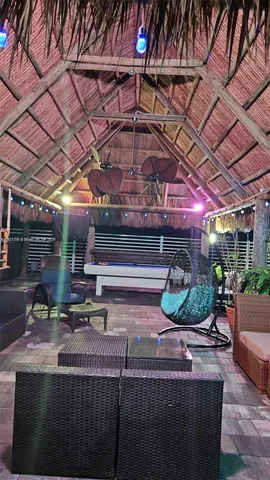 a view of a green field with trees