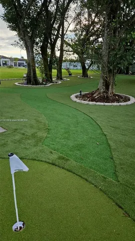 a lake view with a big yard