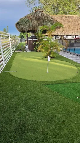 a view of a golf course with a lake