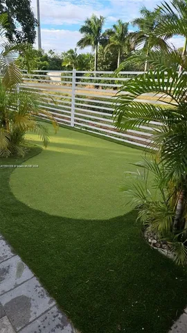 a view of a golf course with a lake view