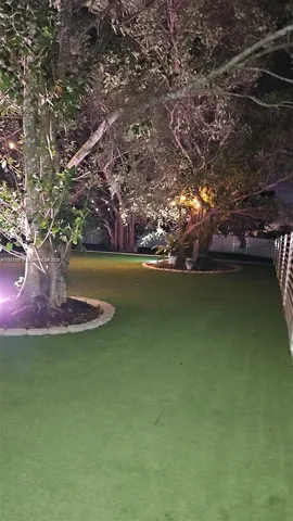 an aerial view of residential houses with outdoor space and river